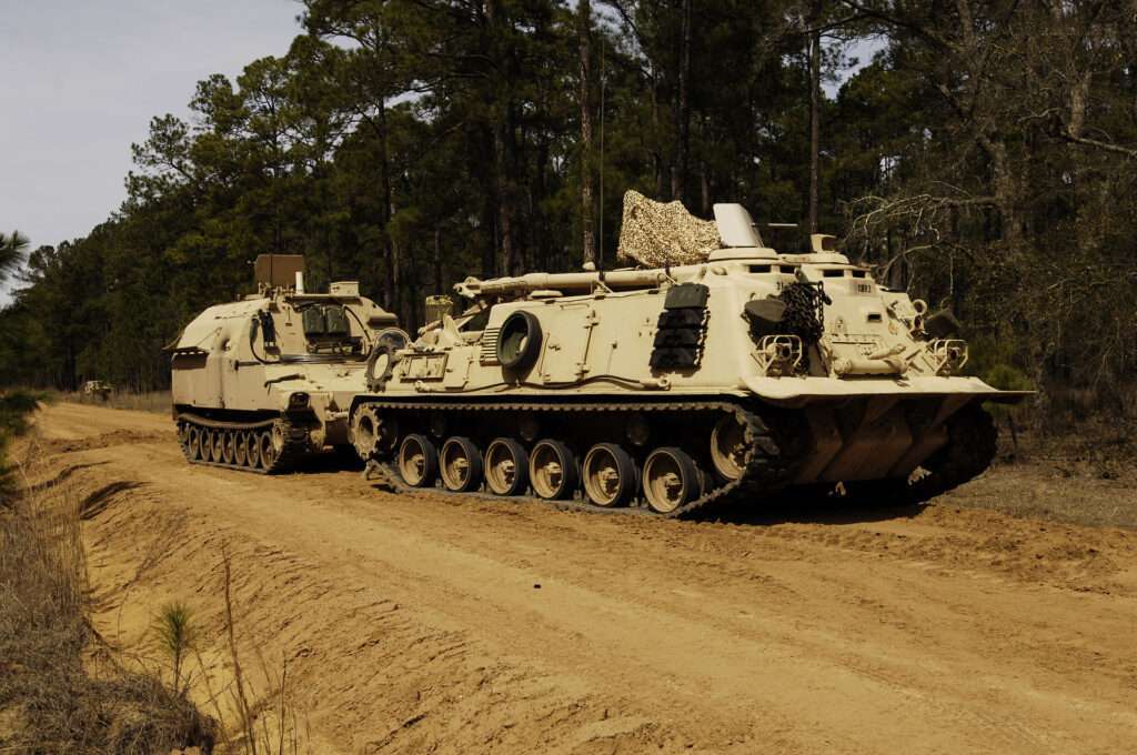 An M88 pulling a broken down armored vehicle.