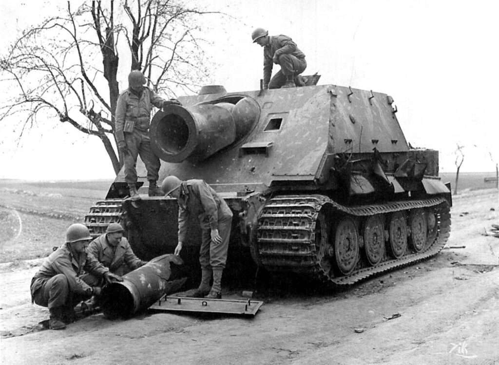 An abandoned Sturmtiger under inspection by US troops.