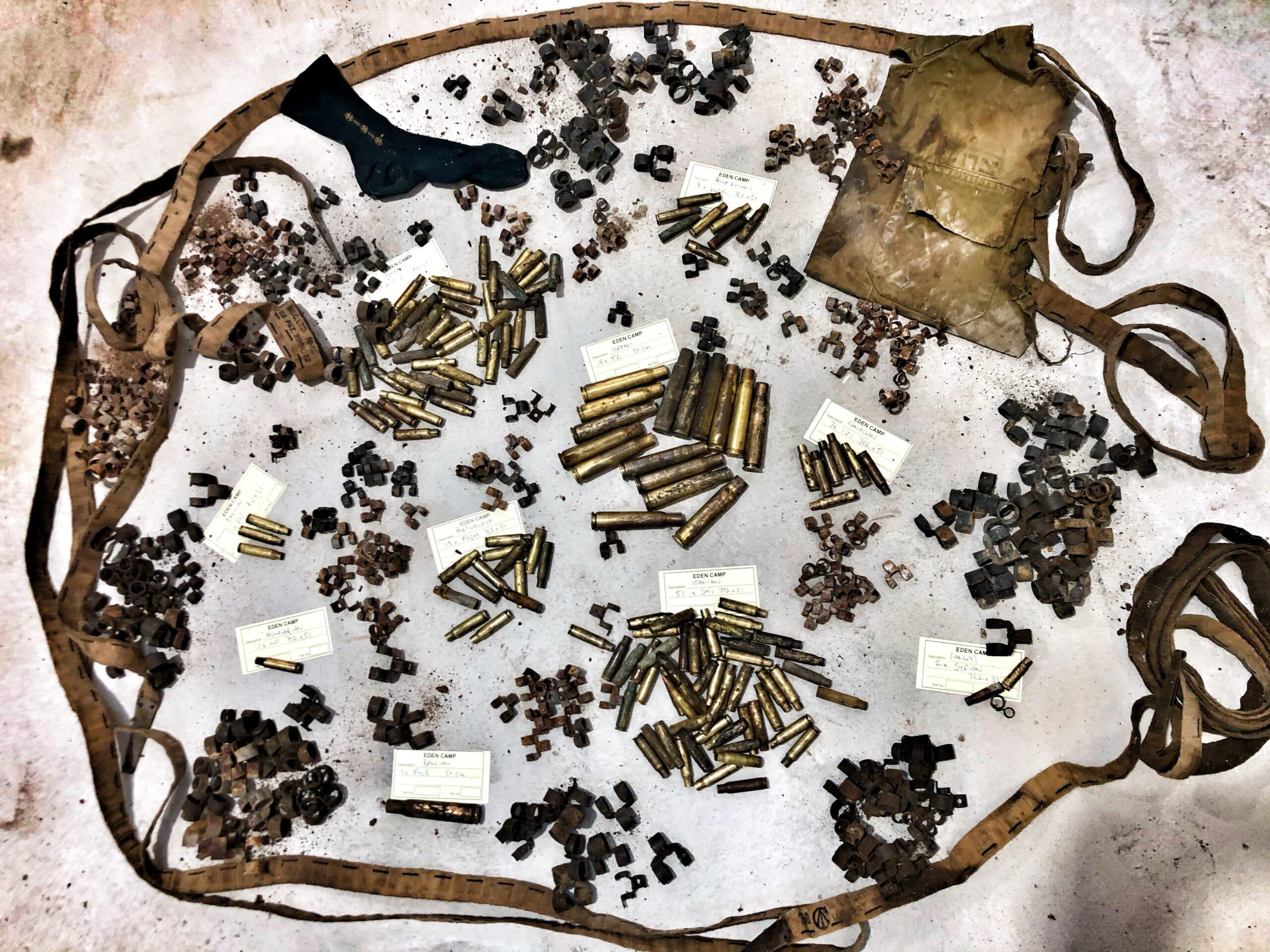 M50 artifacts removed during restoration, including .50 calibre bullets and links.